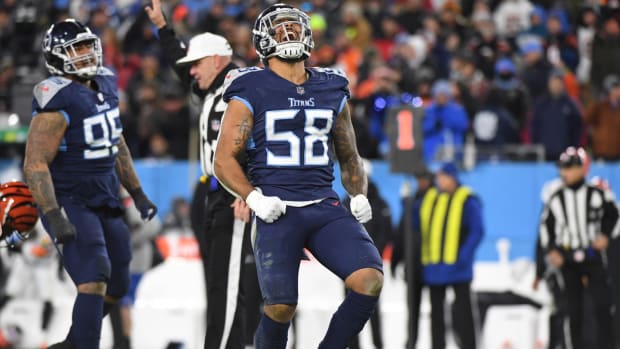 Titans edge rusher Harold Landry celebrates a play.